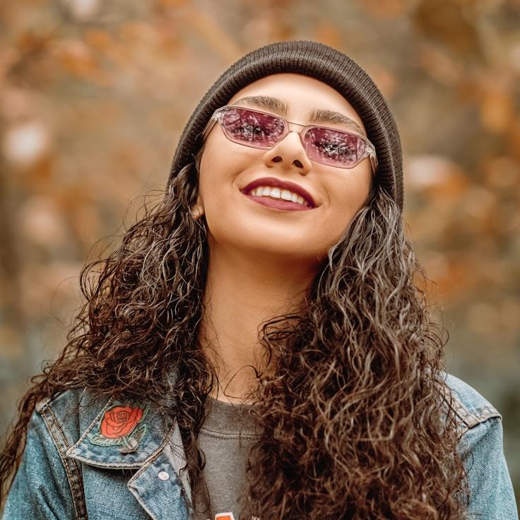 A. Singh, Lead Design Curator at Plain Field Craft, reviewing corporate floral arrangements